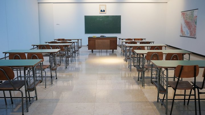 School classroom with desks and learning materials